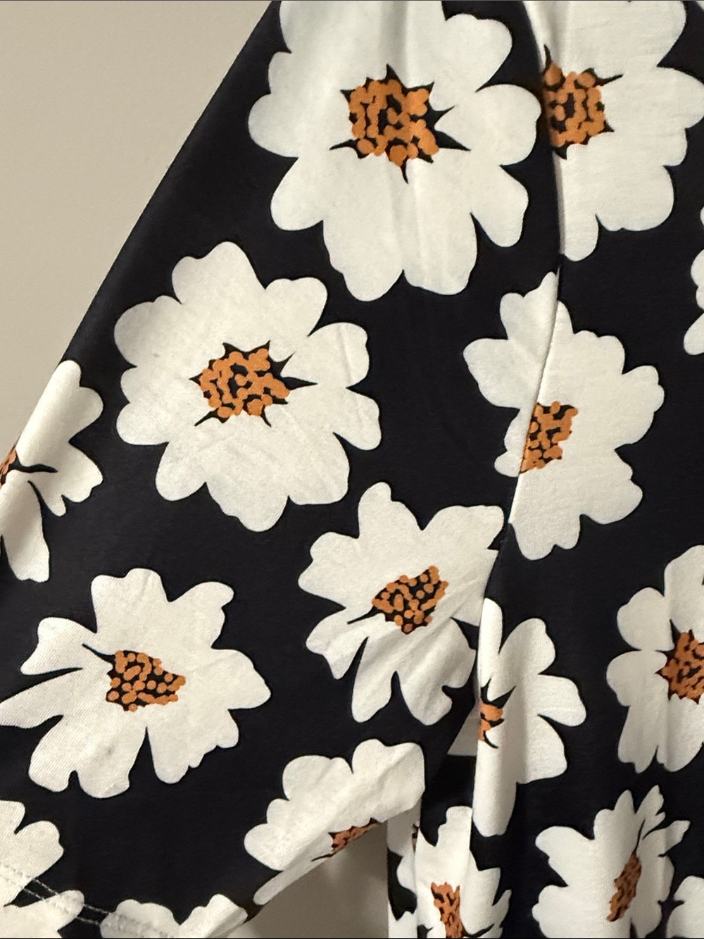 LuLaRoe Black Short Sleeve Tee with White and Golden Daisy Print - Picture 4 of 5